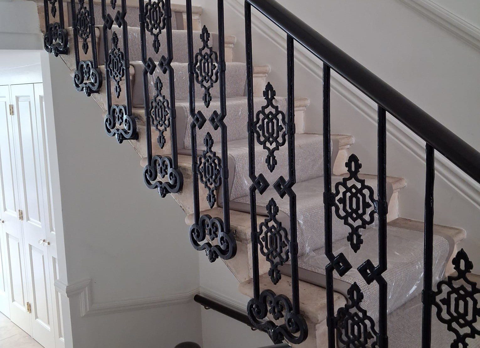 Cast iron balustrade panels on a period staircase, South Kensington